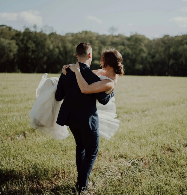 Newlyweds in a field